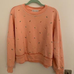 Salmon floral sweatshirt.